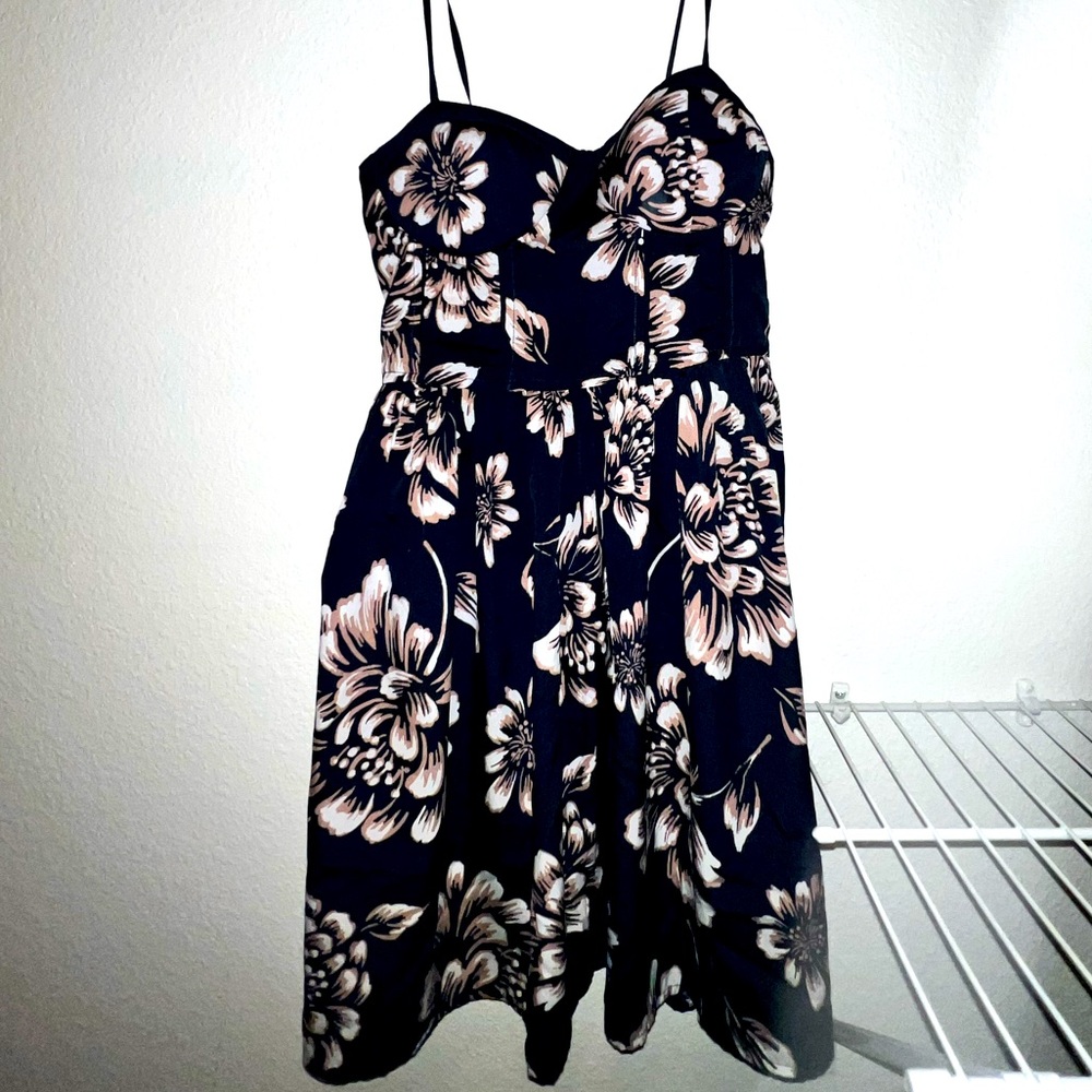 Beautiful floral spaghetti strap dress with a sweetheart neck line!
